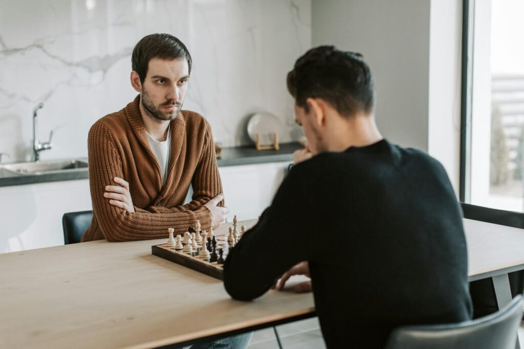 Men Playing Chess Together